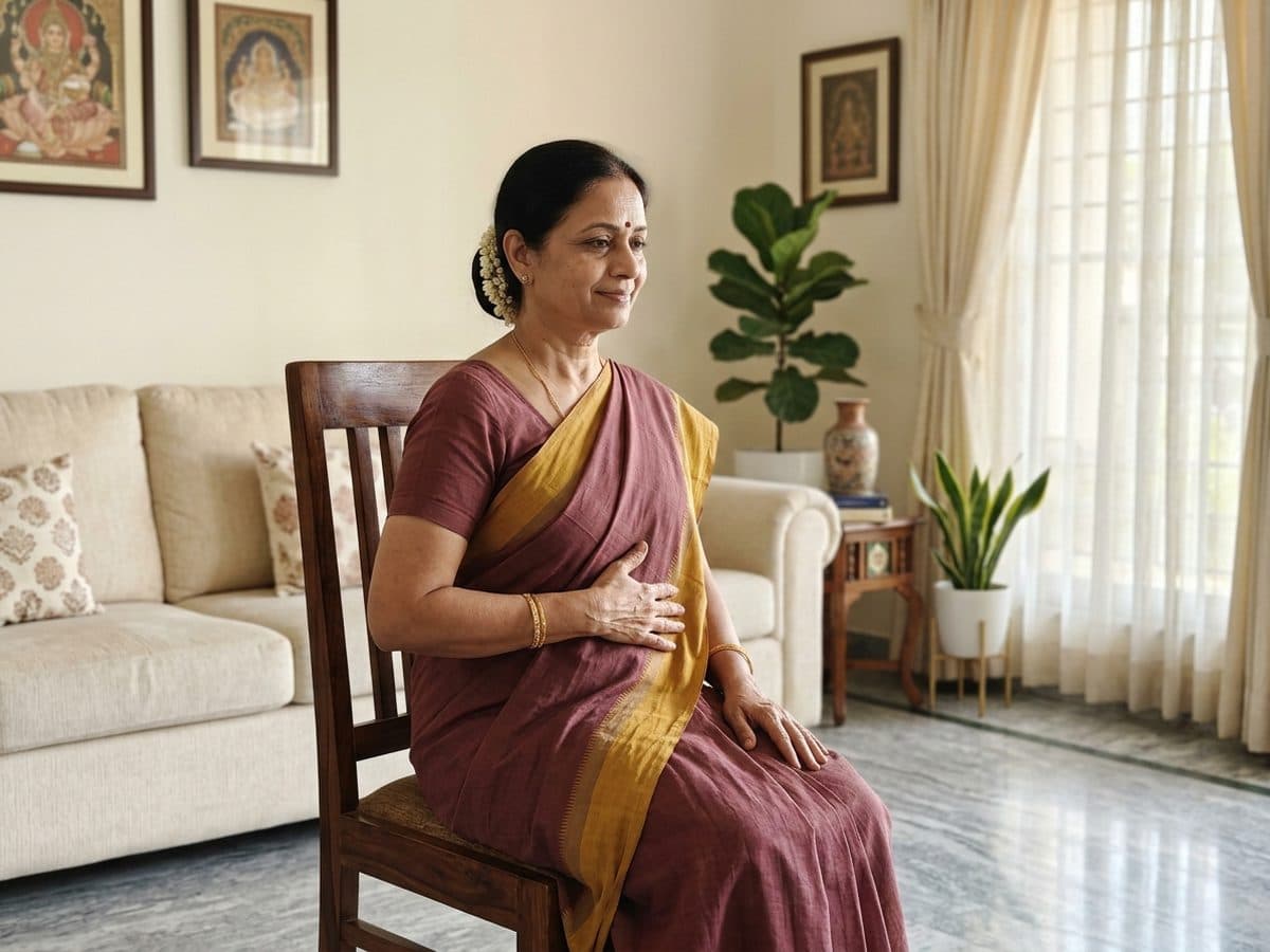Slow breathing practice: an older Indian adult demonstrating the exercise at home