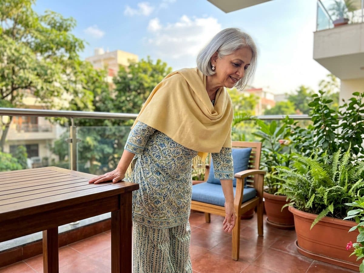 Pendulum swing: an older Indian adult demonstrating the exercise at home